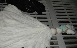 How to dip tie dye t-shirts into a soda ash water solution.