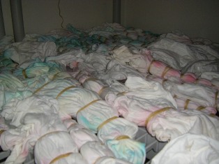How to dip tie dye t-shirts into a soda ash water solution.