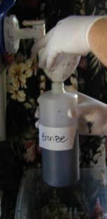 Shake and swirl bottle to mix dye powder into the water.